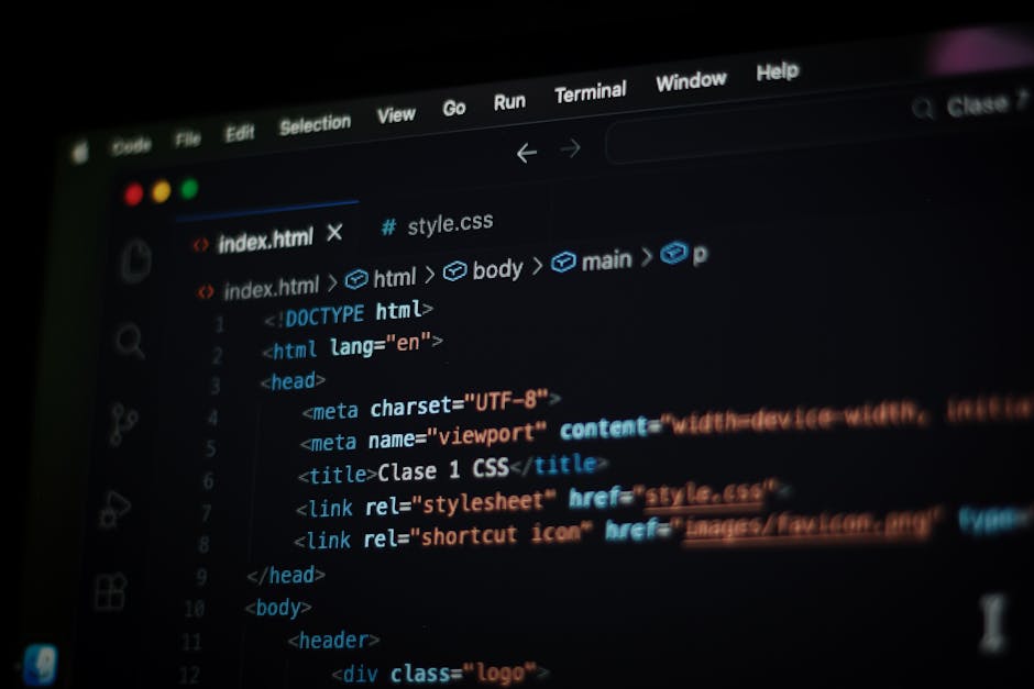 A close-up view of a computer screen displaying HTML code, including tags such as <html>, <head>, <title>, and <body>. The code is color-coded with different syntax highlighting, showing elements like